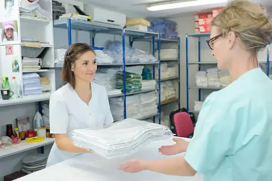 Restaurant laundry service folding fresh linens in Orlando FL